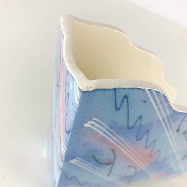 Fabulous vintage handmade pottery napkin holder with 80s post modern design. Squiggles and pastels. So good! Sits back on...