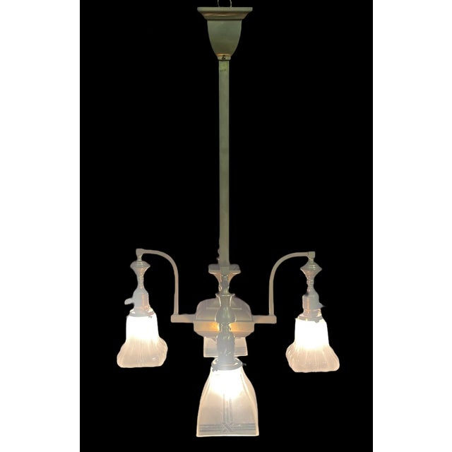 This gas-electric converted chandelier is unique from top to bottom!! Originally, two arms would burn gas and the other...