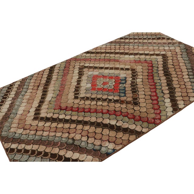 A rare 4x7 antique hooked rug of United States’ provenance, handmade in wool and fabric, circa 1920-1930, featuring...