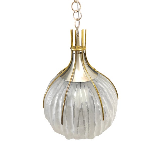 Chandelier with a spherical shape in glass and structure in brass and steel. It takes its name as Esperia and is a design...