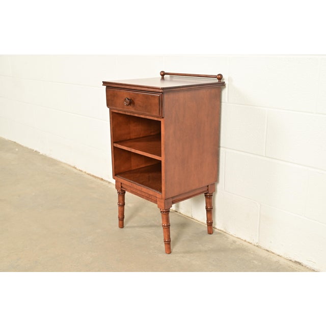 A gorgeous antique Regency style nightstand or side table By Stickley Brothers USA, Early 20th Century Solid birch, with...