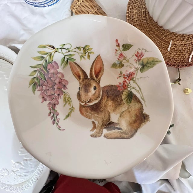 Serving bowl with rabbit design in spring colors. Made in Italy. Measures 8.5” diameter x 2.5” high.