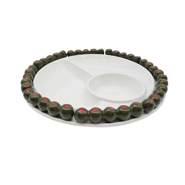 A dish like this doesn’t simply serve—it stages a scene. Glossy white ceramic, molded in the gentle geometry of a mid-...