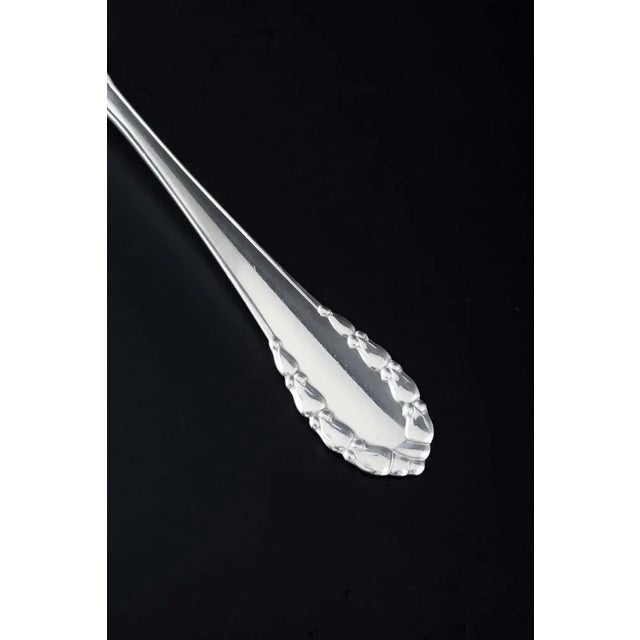 Georg Jensen, Denmark. Meat fork in the “Lily of the Valley” pattern. Mirror-polished sterling silver, with an elegant...