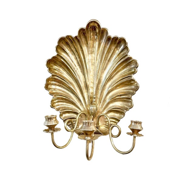 Stunning pair of large size brass three light wall sconces. Each arm is fully adjustable with a brass screw. The back...