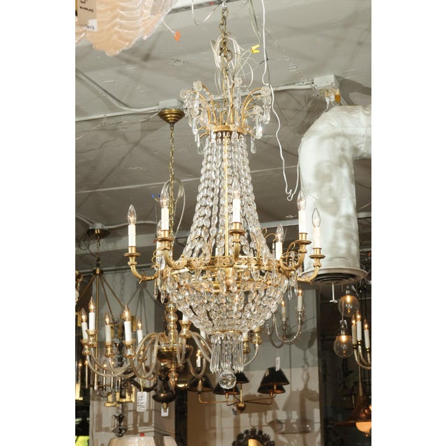 This chandelier is a stunning example of the D'ore bronze French empire style from the late 19th Century. Miraculously,...
