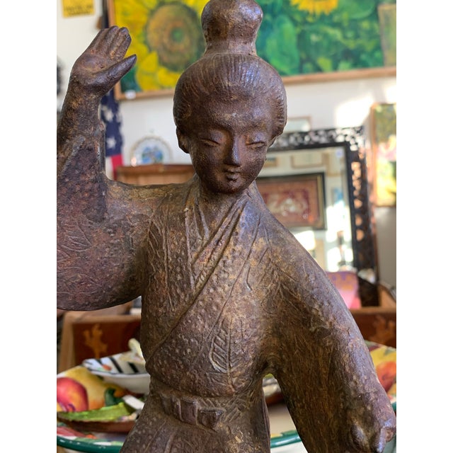 Beautiful vintage cast iron sculpture depicting a graceful Asian dancer in traditional attire. This solid, heavy piece...