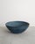 A rare oversized Swedish mid century decorative large ceramic bowl in a blue glaze with light brown impressed and...