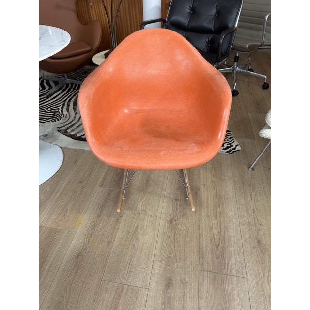 Fiberglass Rocking Armchair by Charles and Ray Eames, 1970s, in Good conditions. Designed 1950 to 1959 This piece has an...