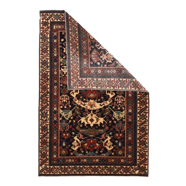 This east Caucasian, moderately finely woven, good condition scatter combines an ivory ground rosette and diagonal bar...
