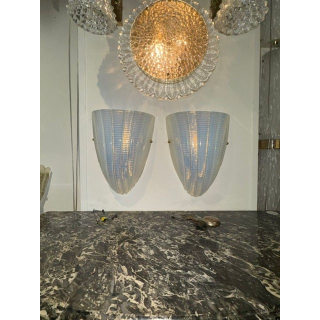 These Murano Opalescent Shell Sconces are a stunning pair of lighting fixtures that add a touch of elegance to any room....