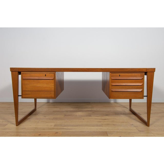 Model 70 desk designed by Kai Kristiansen for the Danish manufacture Feldballes Møbelfabrik in the mid-1960s. A modernist...