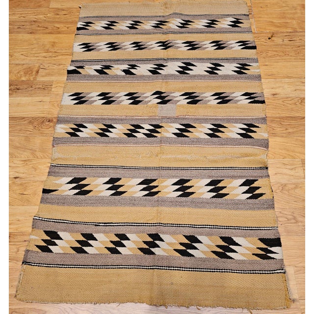 This vintage Navajo rug features a beautifully executed Chinle Revival pattern. Handwoven from native hand-spun wool, this...