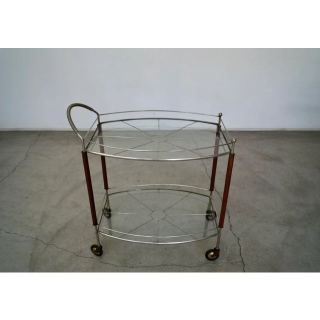 Vintage Mid-century Modern bar cart for sale. Original cocktail server from the 1950's, and beautifully aged. It's metal...