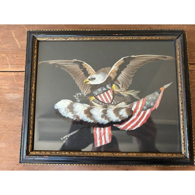 An intricately detailed picture of an American Bald Eagle with the shield and flag of the United States made entirely out...