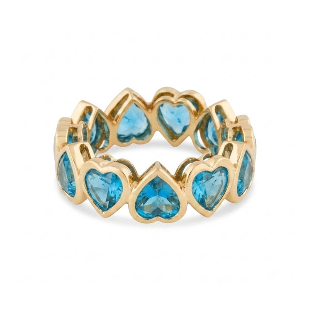 Discover the serene beauty of the eternity band. This elegant piece features a continuous, shimmering loop of heart-shaped...
