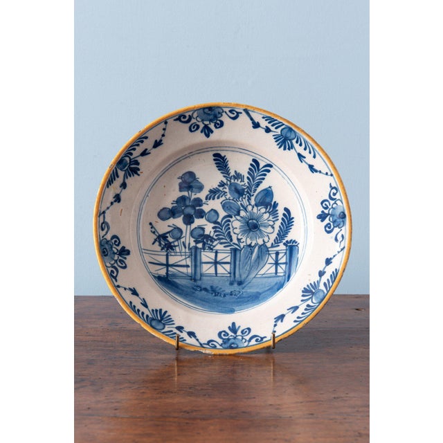 Diameter: 23 cm (each) Height: 3.5 cm (each) Some glaze losses to the edges, a chip to the edge of one plate.