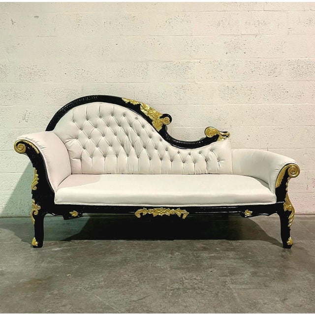 A stunning Rococo-style chaise lounge featuring exquisite craftsmanship and luxurious detailing. The hand-carved frame is...