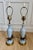 Elegant pair of vintage table lamps crafted from pale powder-blue opaline glass with delicate gilt detailing, gilt-metal...