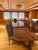 Large Victorian-style mahogany dining table with an extendable top. Carved base with gilt brass details. Excellent...
