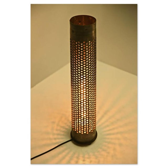 These unique lighting fixtures, made from real perforated shell casings, embody authenticity and industrial history. with...