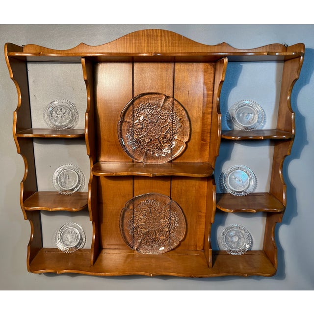 Simple grace and durability allows this wall curio shelf to display your favorite china cups, plates and saucers. American...