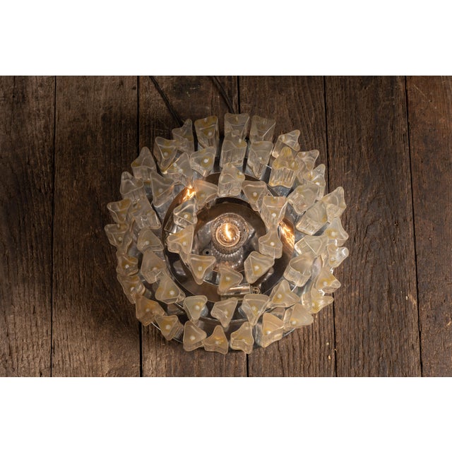 Tiered flush mount ceiling light featuring concentric rows of faceted Lucite columns arranged in a stepped, crown-like...