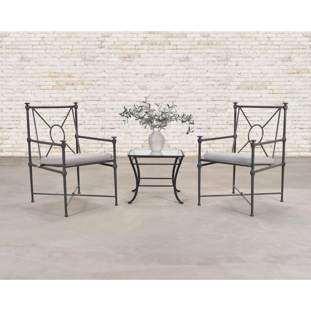 A refined set of Restoration Hardware “Catalina” dining chairs, constructed in a neoclassical garden style having an iron-...