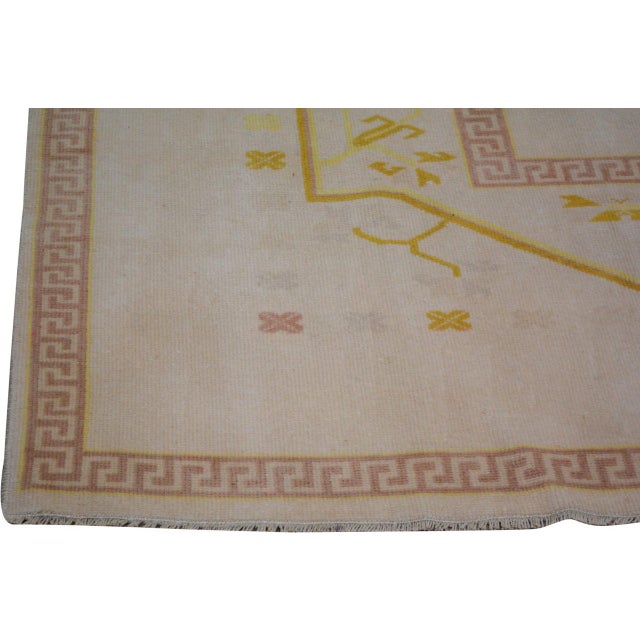 Hand-knotted with care using traditional rug-making techniques, this wool rug blends timeless craftsmanship with a modern...