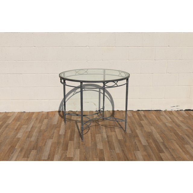 Beautiful vintage “Amalfi” round dining table designed by Mario Papperzini for Salterini in the 1950s. This elegant table...