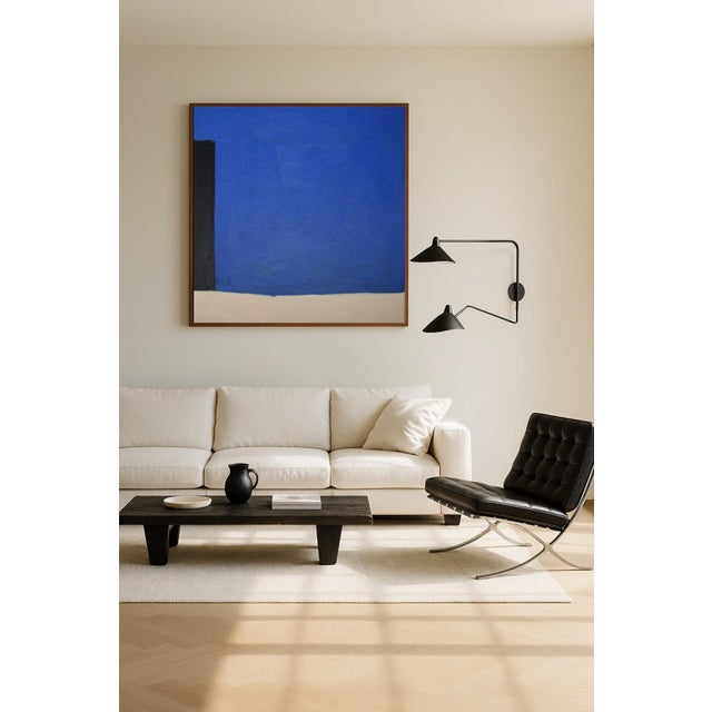A bold dialogue between calm and contrast. This original square painting features intense cobalt blue, softened by beige...
