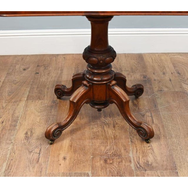A fine Victorian mahogany fold-over games table dating from around 1860 The rectangular top features rounded corners and...