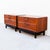 A newly refinished pair of mid century modern walnut nightstands or commodes on black lacquer bases with brass hardware,...