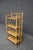 Victorian etagere featuring a burnt bamboo frame with turned detailing, rounded finials, and four quarter-sawn oak...