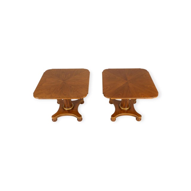 air of Henredon pedestal tables with patterned veneer tops, fluted column supports, and gold-painted accents. Each square...