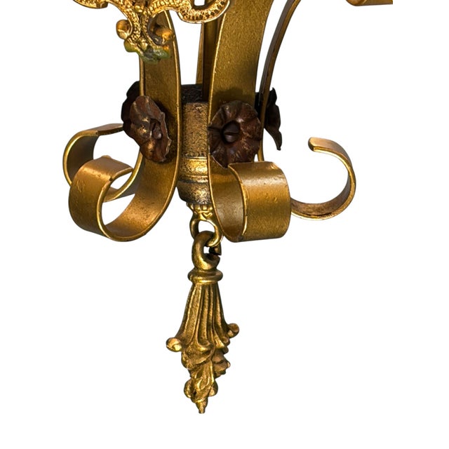 One of two matching chandeliers with original finish. Probably 1920s, with red and green accents over gold paint. This is...