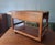 1960s bar cart / serving trolley in teak with a drawer that can be opened from both ends; and a suede holder / bag that...