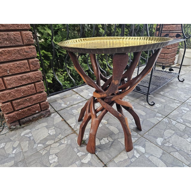 Coffee table, wooden, brass top, 1960s-1980s, dimensions: height 61.5 cm, diameter 58 cm.
