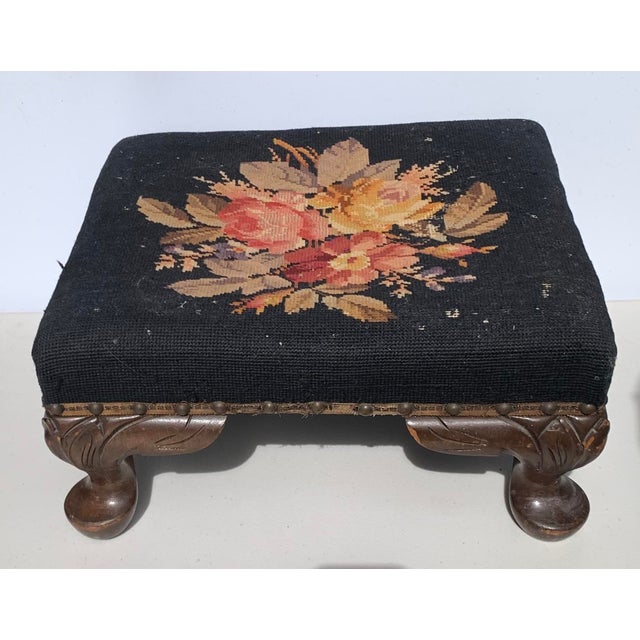 Antique Needlepoint foot stool with carved wood legs. Collection of Mrs. Bob Hope, Toluca Lake, California.
