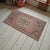Vintage Turkish hand-knotted small rug from Oushak, 1970s, featuring warm faded rose tones and authentic village...