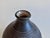 This meticulously crafted ceramic vase by Eva Kumpmann (1920-1917) showcases the characteristic combination of clear...