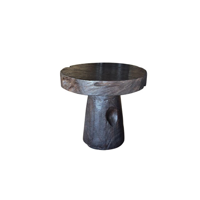 Crafted from solid mango wood, this sculptural side table celebrates the organic beauty of natural hardwood through bold...