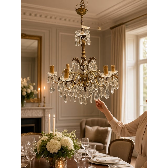 A beautiful vintage Italian brass and crystal chandelier dating from the 1950s. The elegant brass frame is richly adorned...