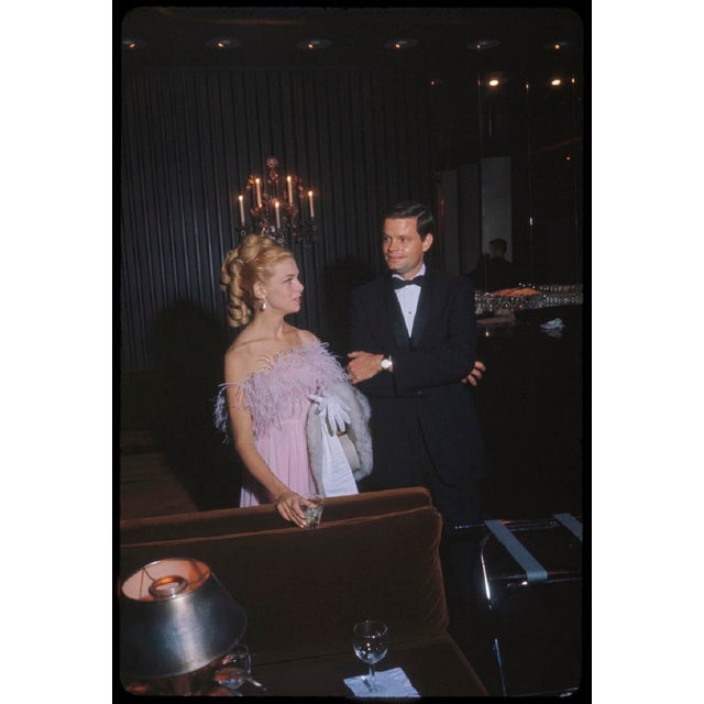 A Couple At The Met by Toni Frissell A couple enjoy drinks in a luxury suite at the opening of the New Metropolitan Opera...