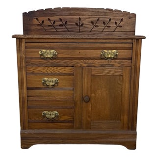Antique Oak Washstand With Carved Backsplash, Cabinet and Brass Hardware For Sale