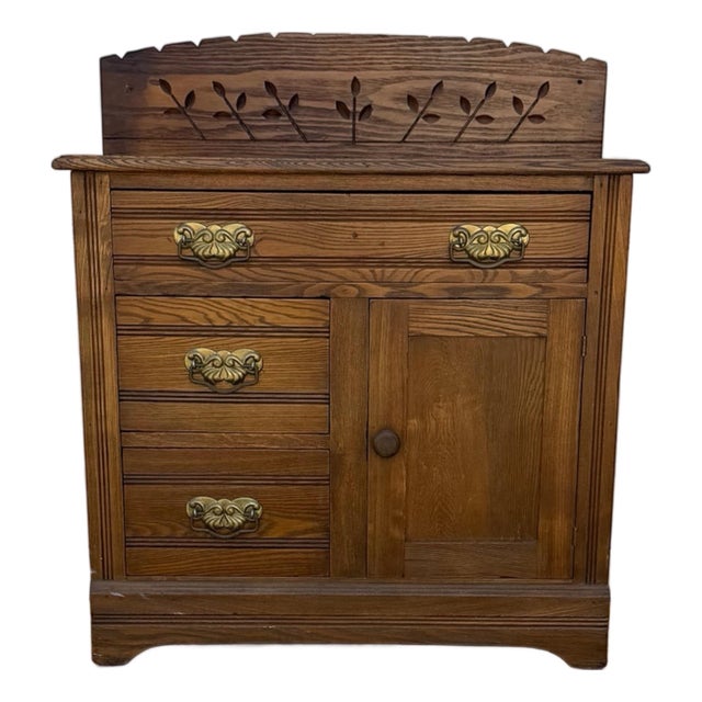 Antique Oak Washstand With Carved Backsplash, Cabinet and Brass Hardware For Sale