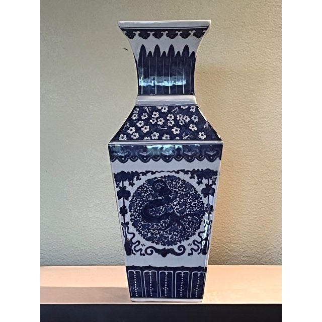 An impressive 18-inch tall Chinese blue and white porcelain vase in a square baluster form. Features central medallion...