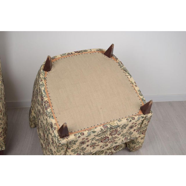 A refined pair of Italian-made armchairs dating back to the 1950s, crafted from fabric and wood, their style and...