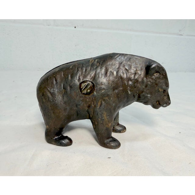 This rare antique 1910 Cast Iron pre-teddy still bank by Arcade is a unique and collectible piece with an exquisite...