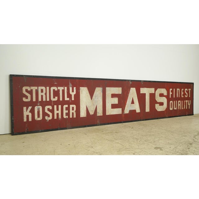 Reclaimed movie set sign made of aluminum in white, red, and black colors. The sign reads "Strictly Kosher Meats Finest...